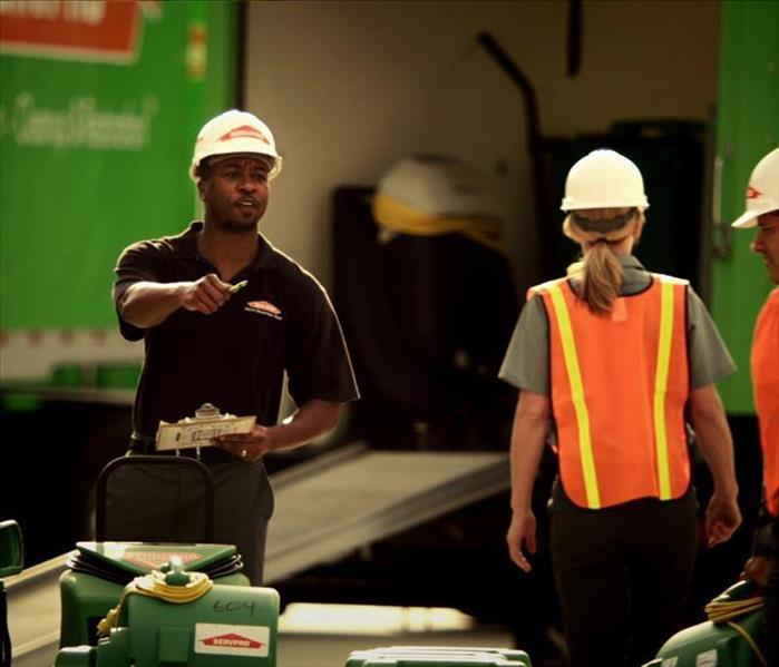 SERVPRO workers with helmets