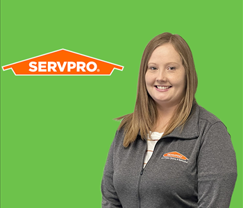 woman in front of servpro logo